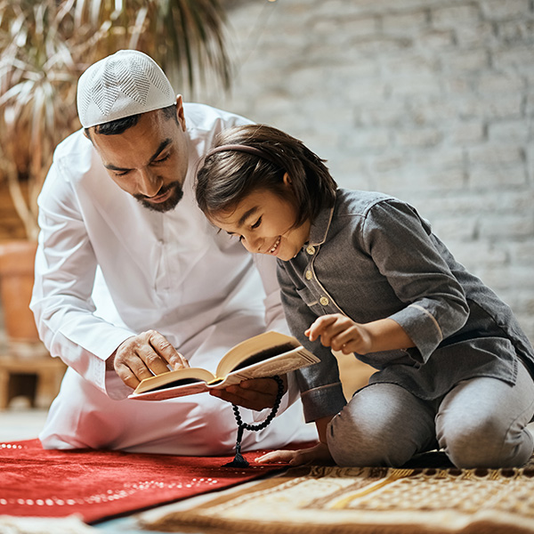 happy-muslim-girl-and-her-father-reading-quran